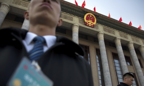 Security staff stand guard outside the Great Hall of the People in Beijing