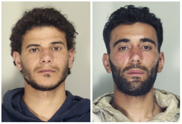 (L-R) Mahmud Bikhit, 26, from Syria, and Ali Malek, 27, from Tunisia will be charged for the capsizing of the fishing vessel carrying 850 migrants