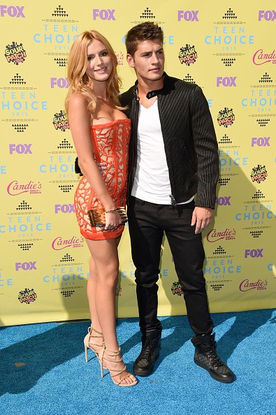 Actors Bella Thorne (L) and Gregg Sulkin attend the Teen Choice Awards 2015 at the USC Galen Center on August 16, 2015 in Los Angeles, California.