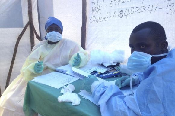 Health workers conducting blood tests in Sierra Leone