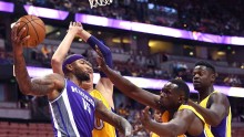 DeMarcus Cousins goes against three Los Angeles Lakers defenders