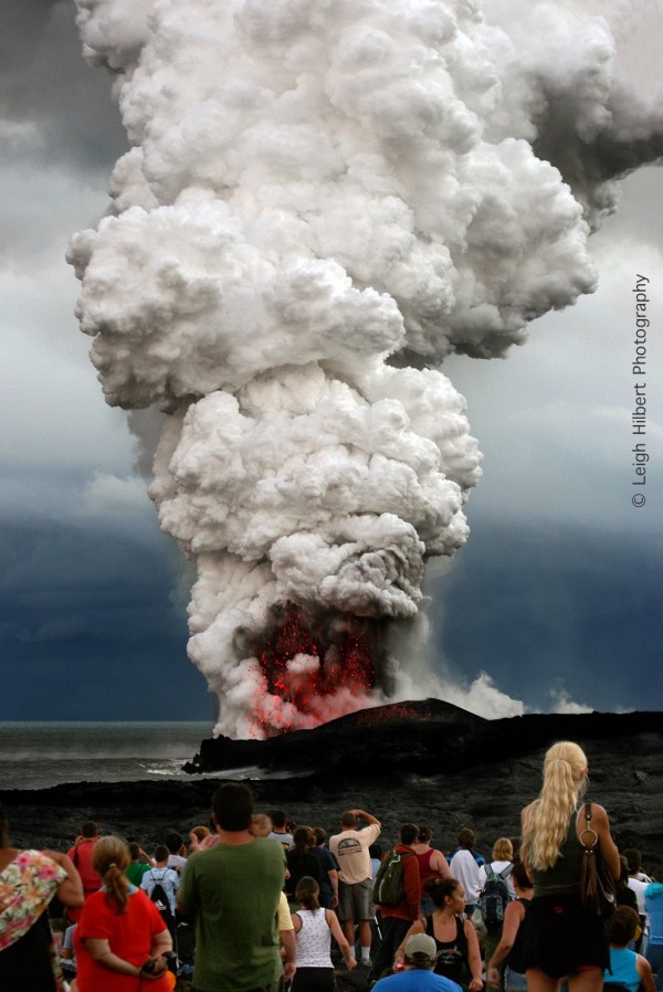 Picture depicts molten lava rushing into the ocean from a volcanic vent - creating a "serious ocean entry" 