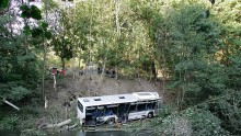 A passenger bus carrying 20 passengers in China plunged into a roadside lake, killing 18 people and hospitalizing two more.