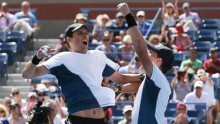 Twin brothers Mike and Bob Bryan became the first doubles players to have won 100 career titles after beating Marcel Granollers and Marc Lopez of Spain at the U.S. Open in Flushing Meadows 