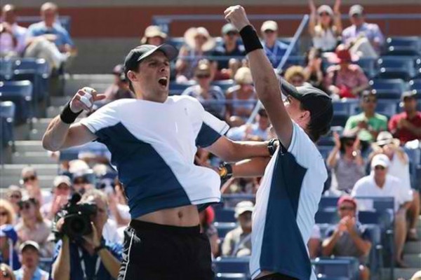 Twin brothers Mike and Bob Bryan became the first doubles players to have won 100 career titles after beating Marcel Granollers and Marc Lopez of Spain at the U.S. Open in Flushing Meadows 