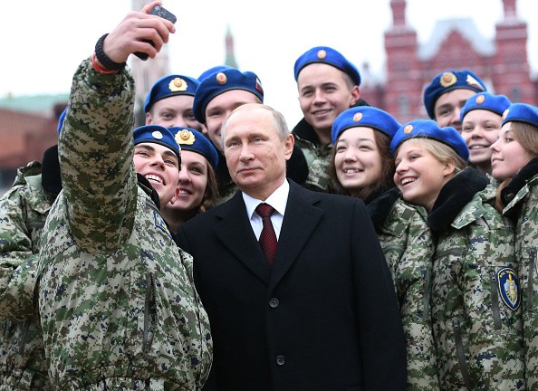 Vladimir Putin takes a selfie with army cadets