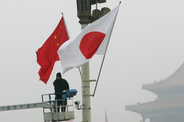 Japanese national flags are hung up at the Tiananmen Square on December 27, 2007 in Beijing, China.