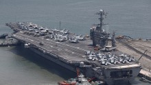  US aircraft carrier USS George Washington sits at anchor in Busan port on July 11, 2014 in Busan, South Korea.