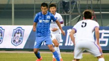 Guangzhou R&F striker Xiao Zhi (L)