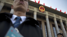 Security staff stand guard outside the Great Hall of the People in Beijing