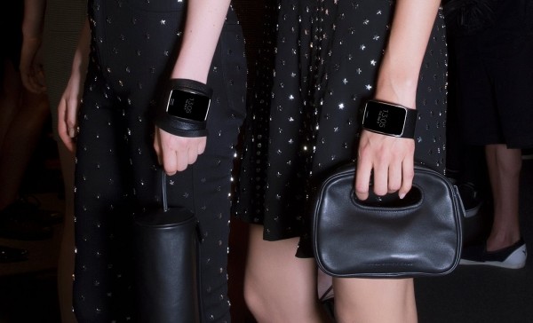 Models wearing custom armbands that Diesel Black Gold made for the Samsung Gear S