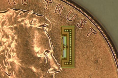 The radio on a coin for scale