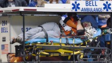 Giancarlo Stanton being carted out on an ambulance after the hit