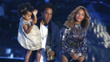 Jay-Z presents the Video Vanguard Award to Beyonce as he holds their daughter Ivy Blue during the 2014 MTV Video Music Awards in Inglewood, California Aug. 24, 2014