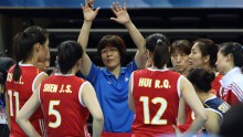 Coach Lang Ping instructing the Chinese nationals to put their hands up and block more shots