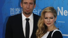 Avril Lavigne and her husband Chad Kroeger pose on the red carpet at the Huading Awards ceremony in Macau in 2013