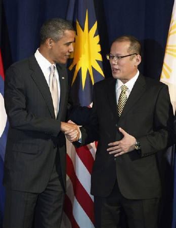 President Obama and Philippines President Benigno Aquino III shake hands during a group photo opportunity at the Sept. 24, 2010 ASEAN leaders meeting at New York.