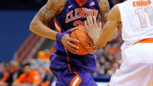 Feb 9, 2014; Syracuse, NY, USA; Clemson Tigers forward K.J. McDaniels (32) drives to the basket against the defense of Syracuse Orange guard Tyler Ennis (11) during the second half at the Carrier Dome. Syracuse defeated Clemson 57-44. 