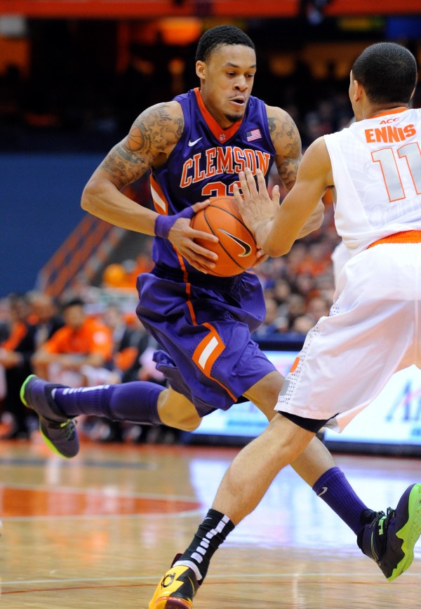 Feb 9, 2014; Syracuse, NY, USA; Clemson Tigers forward K.J. McDaniels (32) drives to the basket against the defense of Syracuse Orange guard Tyler Ennis (11) during the second half at the Carrier Dome. Syracuse defeated Clemson 57-44. 