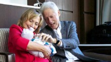 Bill and Hillary Clinton with granddaughter Charlotte