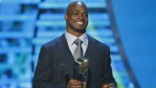 Adrian Peterson receives the NFL MVP award.