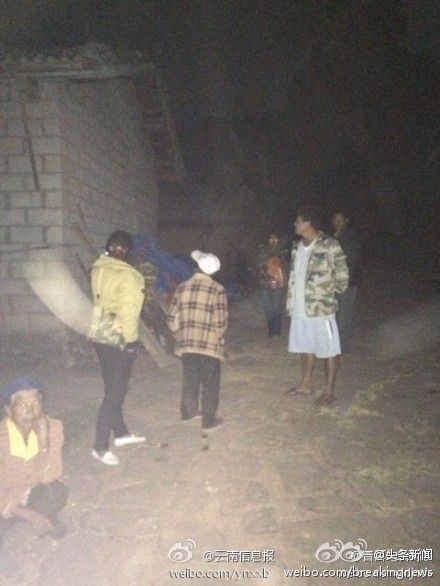 Yunnan residents leave their homes after they felt the quake. Witnesses reported hearing  buildings vibrate as they shook.