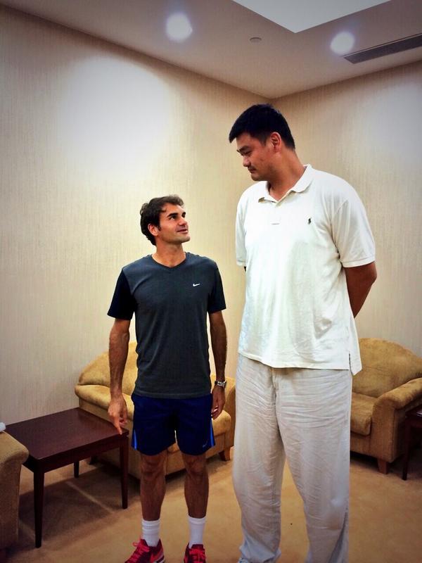 Six foot one Roger Federer looks up to former NBA star Yao Ming, literally 