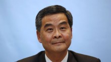 Hong Kong Chief Executive CY Leung faces tough questions over £4 million payout from Australian company.