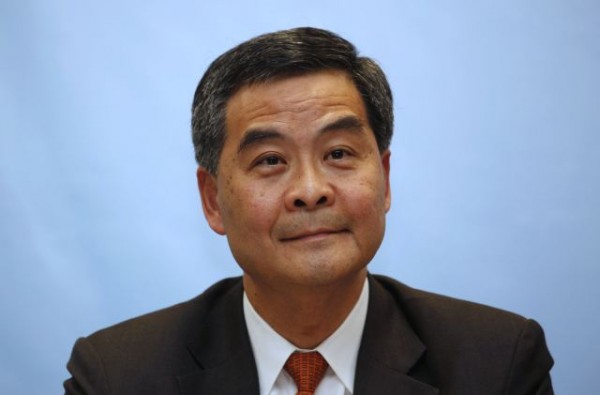 Hong Kong Chief Executive CY Leung faces tough questions over £4 million payout from Australian company.
