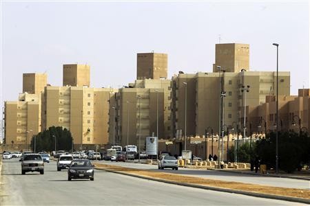 Cars drive past a housing compound located south of the capital in Riyadh, December 17, 2012.