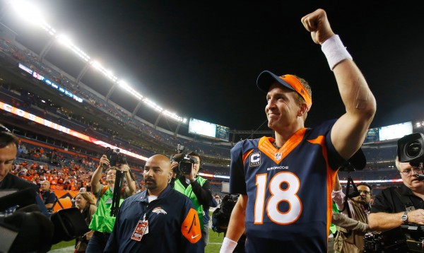 Oct 19, 2014; Denver, CO, USA; Denver Broncos quarterback Peyton Manning (18) waves to the crowd as he runs off the field after the game against the San Francisco 49ers at Sports Authority Field at Mile High.