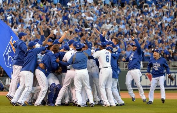 Kansas City Royals players celebrate on the field after game four of the 2014 ALCS playoff baseball game against the Baltimore Orioles at Kauffman Stadium.