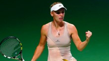 Danish star Caroline Wozniacki ousted second seeded Maria Sharapova in an epic three set match that lasted more than three hours at the WTA Finals in Singapore 