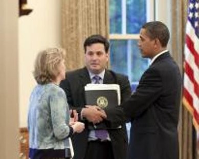 U.S. President Barack Obama (R) meets with Ron Klain, then chief of staff to the Vice President, and Cynthia Hogan, counsel to the vice-president, in the Oval Office, in this May 21, 2009 photograph obtained by Reuters on October 20, 2014.
