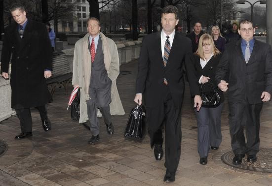 Blackwater guards Evan Liberty (L) and Dustin Heard (R) leave a federal courthouse with their defense lawyers and supporters after they were arraigned on manslaughter charges for a 2007 mass shooting incident in Baghdad, Iraq in Washington, January 6, 200