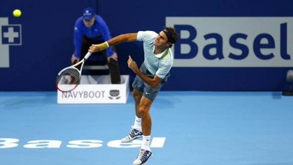 Top seeded Roger Federer rallied from a set down to defeat Denis Istomin 3-6 6-3 6-4 and meet Bulgarian star Grigor Dimitrov at the quarterfinals of the Swiss Indoors in Basel