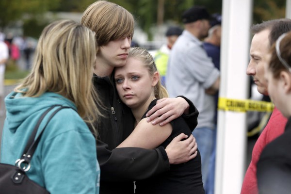 Students and family members reunite at Shoultes Gospel Hall after a student opened fire at Marysville-Pilchuck High School