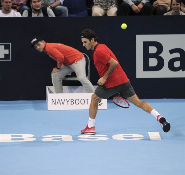 Top seeded Roger Federer escaped a threat from Croatian Ivo Karlovic and has eyed a sixth title at the Swiss Indoors in Basel