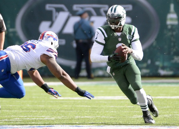 STATESOct 26, 2014; East Rutherford, NJ, USA; New York Jets quarterback Michael Vick (1) runs with the ball against the Buffalo Bills in the first half at MetLife Stadium. 