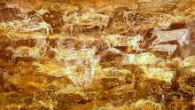 Prehistoric paintings of hoofed animals in a cave with thunderous reverberations located in Bhimbetka, India