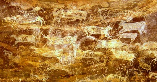 Prehistoric paintings of hoofed animals in a cave with thunderous reverberations located in Bhimbetka, India