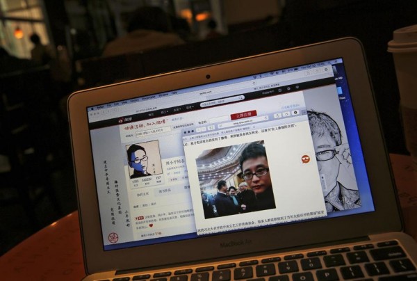 This screen shot shows Chinese Patriotic Blogger, Zhou Xiaoping's Sina Weibo account and his selfie near Chinese.