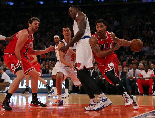 Oct 29, 2014; New York, NY, USA; Chicago Bulls guard Derrick Rose (1) drives under the basket against the New York Knicks during the first quarter at Madison Square Garden. 