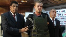 Joran Van der Sloot, center, is escorted by Peruvian police officers at the police headquarters in Lima, in 2010.