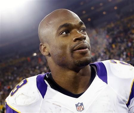 Minnesota Vikings running back Adrian Peterson leaves the field after a season-ending loss to the Green Bay Packers in Green Bay, Wisconsin in this file photo taken January 5, 201