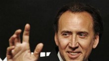 Nicolas Cage waves as he arrives at a replica of a street in Monte Carlo ahead of a launch ceremony of Mont Blanc's new Princesse Grace de Monaco jewelry collection inside the Mont Blanc concept store in Beijing June 1, 2012.