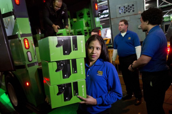 Best Buy Co. employees unload Xbox consoles during the Microsoft Corp. midnight launch