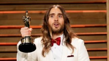 Actor Jared Leto holds his award for best supporting actor as he arrives at the 2014 Vanity Fair Oscars Party in West Hollywood, California March 2, 2014. 