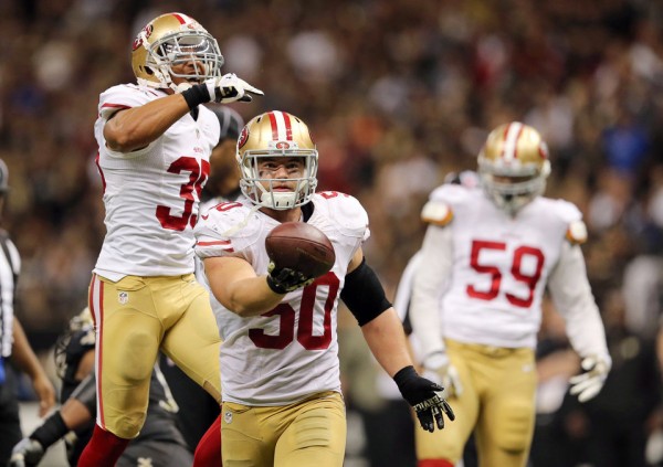 Nov 9, 2014; New Orleans, LA, USA; San Francisco 49ers inside linebacker Chris Borland (50) celebrates after a fumble by New Orleans Saints quarterback Drew Brees (not pictured) in overtime at Mercedes-Benz Superdome. The 49ers won 27-24.