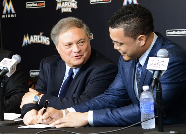 Giancarlo Stanton signing his contract with the Marlins